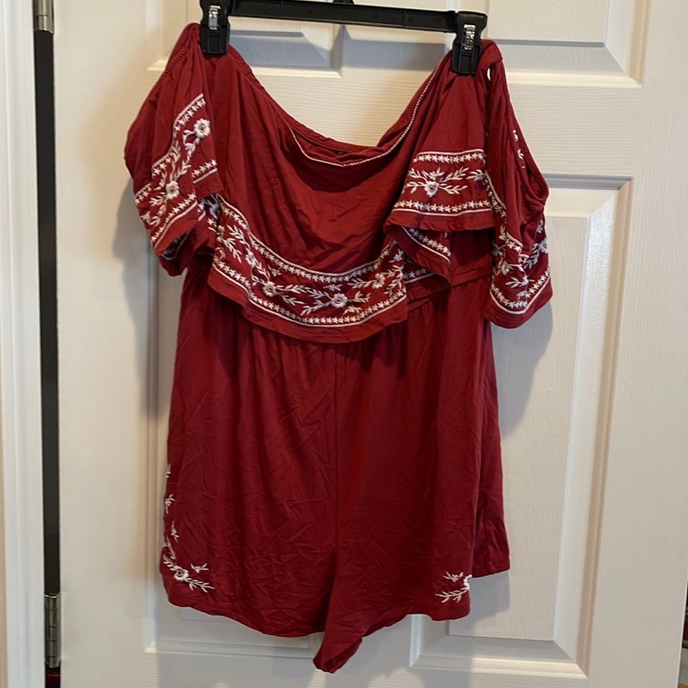 Brand new rust colored shorts romper with elastic cap sleeves.  Size large